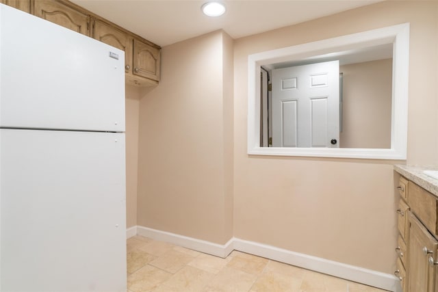 laundry area featuring recessed lighting and baseboards