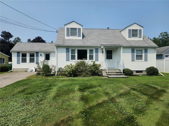 new england style home featuring a front yard