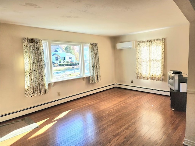 unfurnished room with hardwood / wood-style floors and an AC wall unit