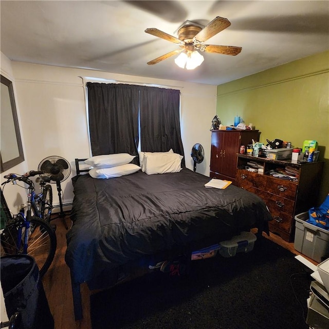 bedroom with hardwood / wood-style flooring and ceiling fan