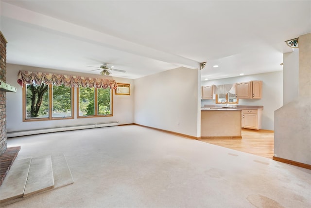 unfurnished living room featuring beam ceiling, ceiling fan, baseboard heating, light carpet, and a fireplace