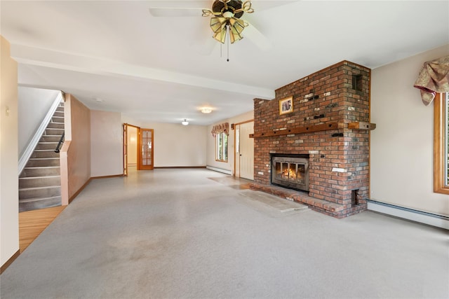 unfurnished living room with beamed ceiling, ceiling fan, baseboard heating, and a brick fireplace