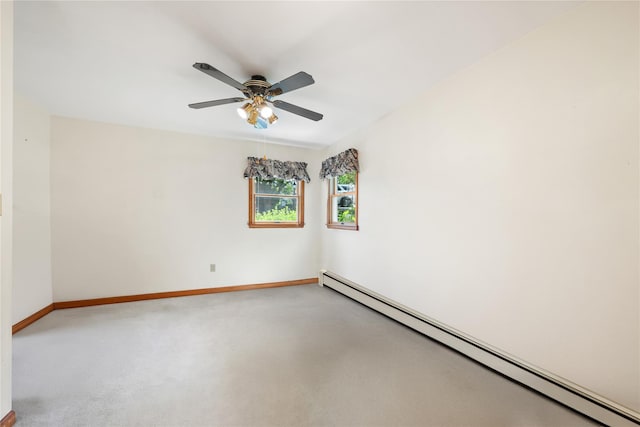 spare room with carpet flooring, a baseboard radiator, and ceiling fan