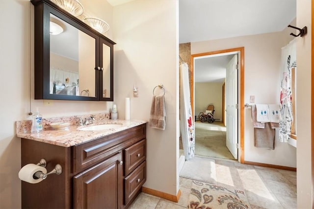 bathroom featuring tile patterned floors, vanity, and a shower with shower curtain