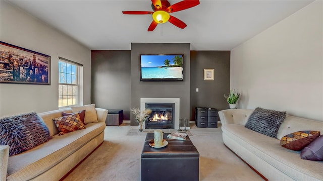 living room featuring carpet and ceiling fan