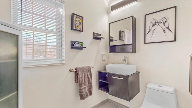 bathroom featuring vanity and toilet