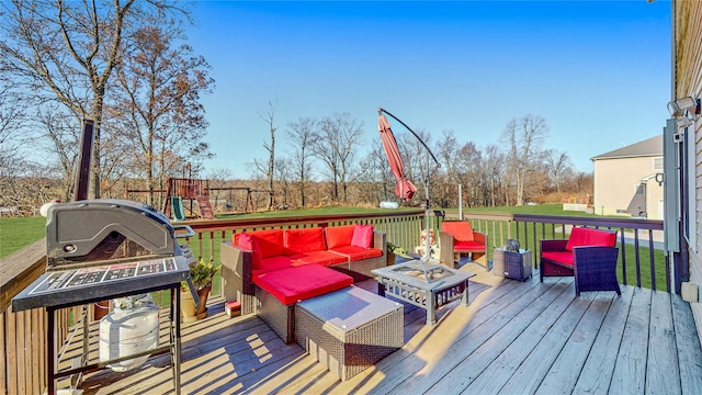 wooden deck with outdoor lounge area, a yard, and a playground