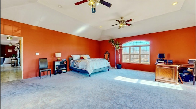 carpeted bedroom featuring ceiling fan and vaulted ceiling