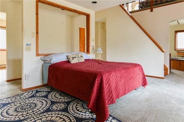 bedroom with light colored carpet