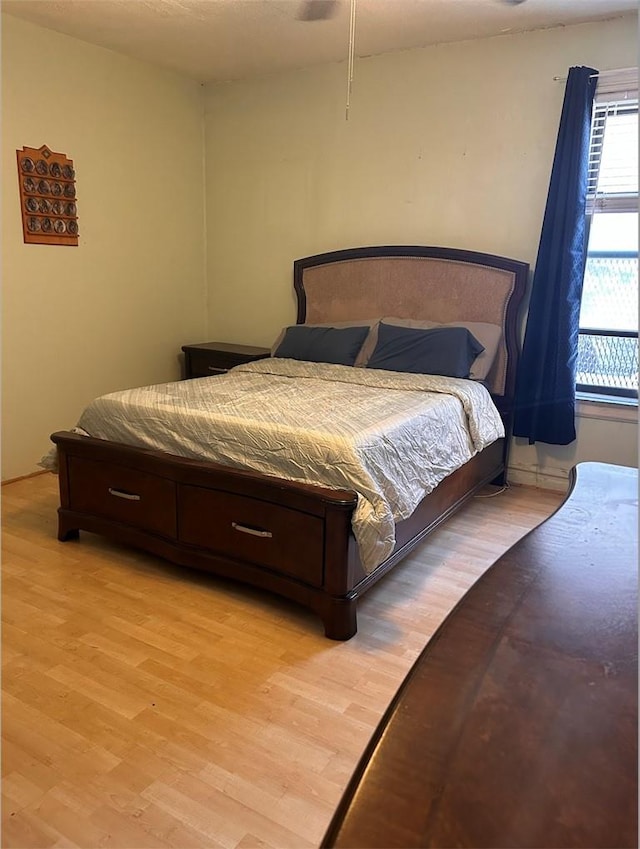 bedroom with light hardwood / wood-style floors