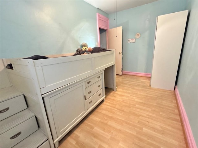 bedroom with light hardwood / wood-style flooring