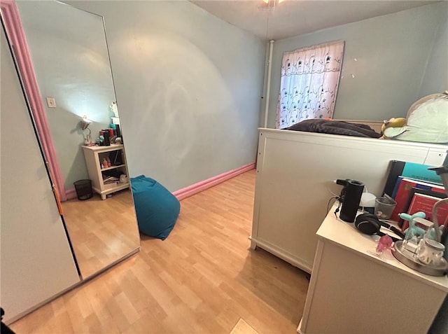 bedroom with light wood-type flooring