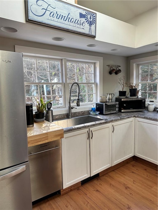 kitchen featuring white cabinets