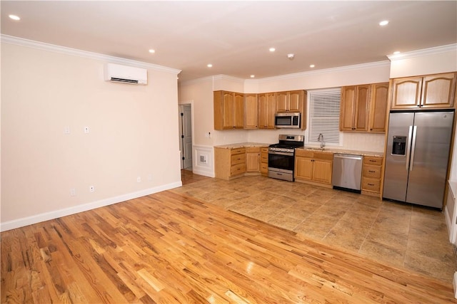 kitchen with appliances with stainless steel finishes, a wall unit AC, crown molding, sink, and light hardwood / wood-style flooring