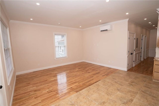 unfurnished room with a wall mounted AC, ornamental molding, and light wood-type flooring