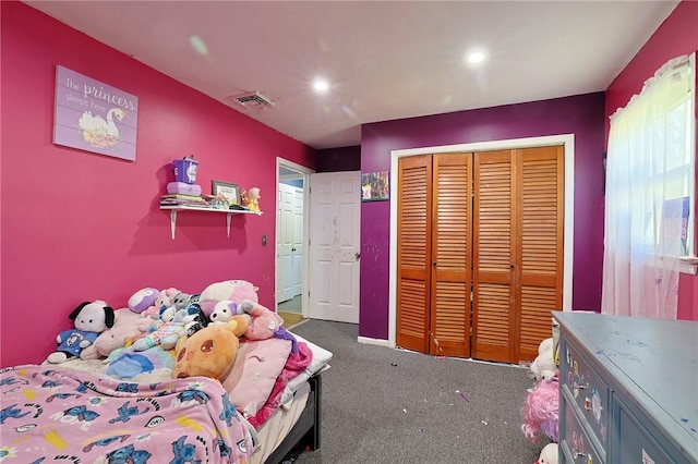 bedroom featuring dark carpet and a closet