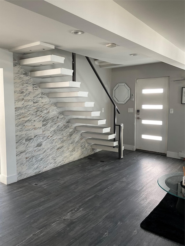 foyer with dark hardwood / wood-style flooring