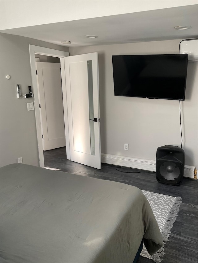 bedroom featuring dark wood-type flooring