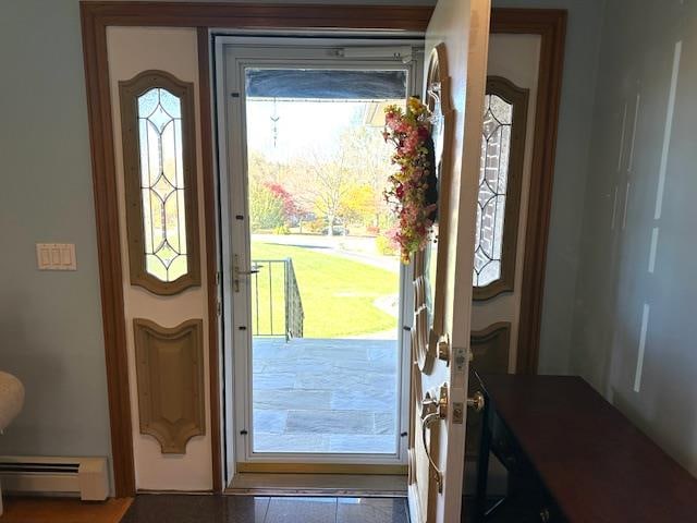 doorway featuring tile patterned flooring and a baseboard radiator