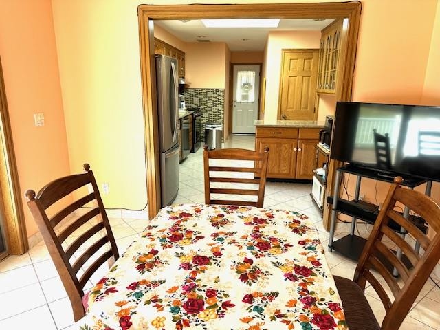 dining room featuring light tile patterned flooring