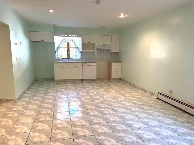 kitchen featuring dishwasher, backsplash, white cabinetry, and sink