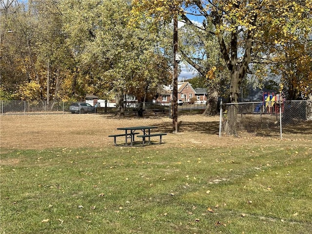 view of home's community with a yard