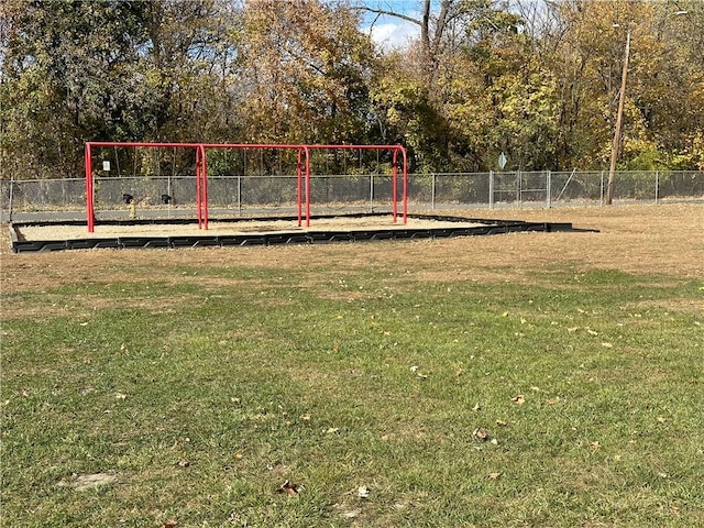 view of property's community featuring a lawn and a playground