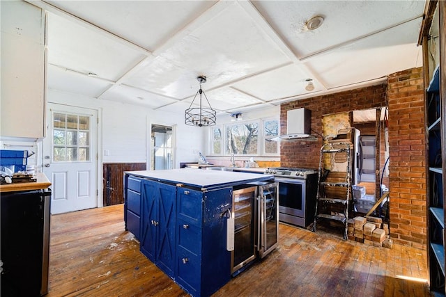 kitchen with stainless steel range, pendant lighting, a center island, and plenty of natural light