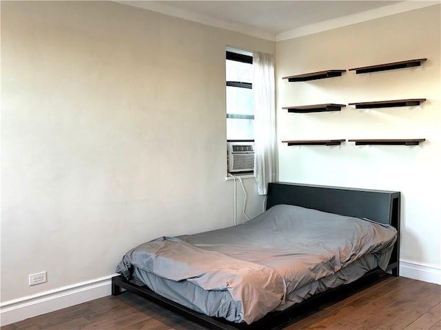 bedroom with dark hardwood / wood-style floors and cooling unit