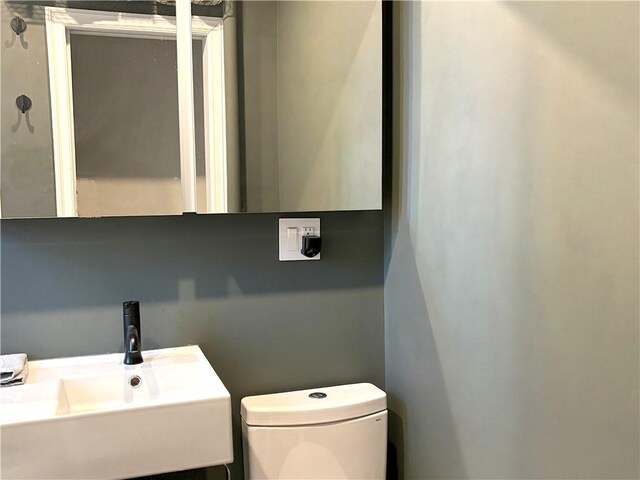 bathroom with toilet and sink