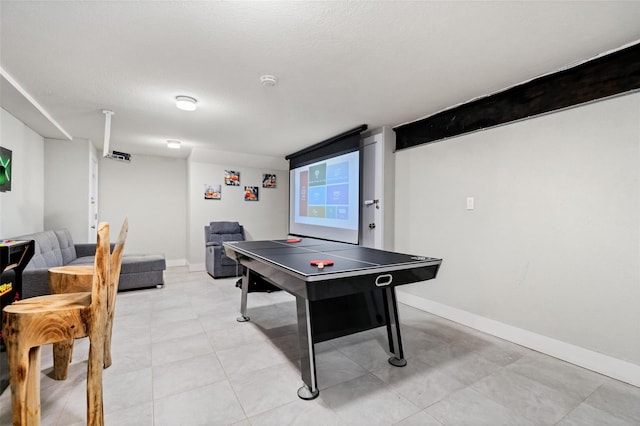 playroom with a textured ceiling