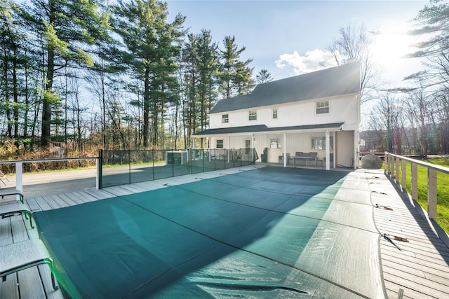 view of swimming pool with a wooden deck