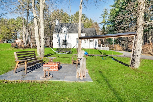 view of yard featuring a patio area and a trampoline