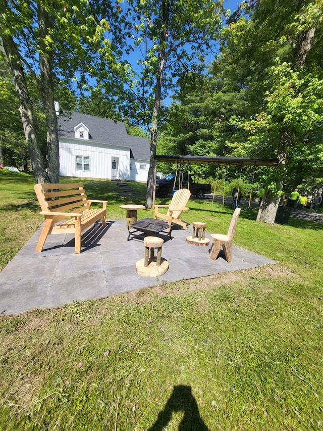 view of patio / terrace featuring a fire pit