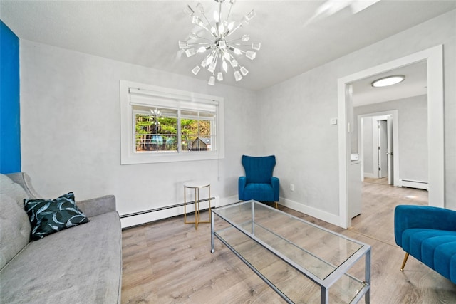 sitting room featuring a baseboard radiator, a notable chandelier, and light hardwood / wood-style floors