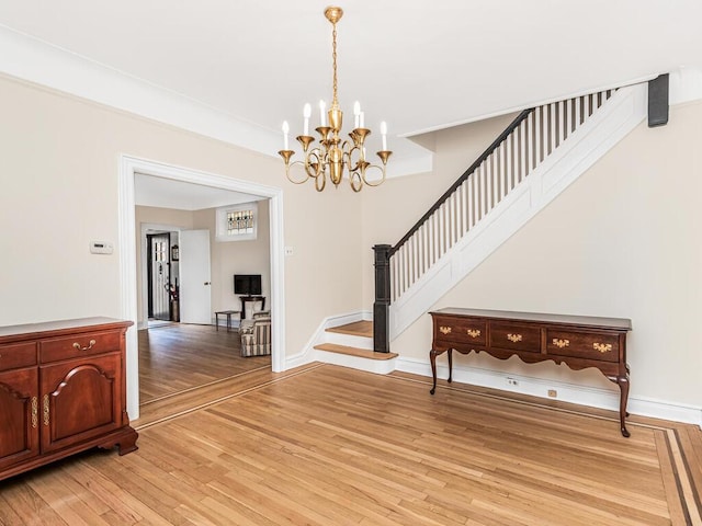 foyer with a notable chandelier and light wood-type flooring