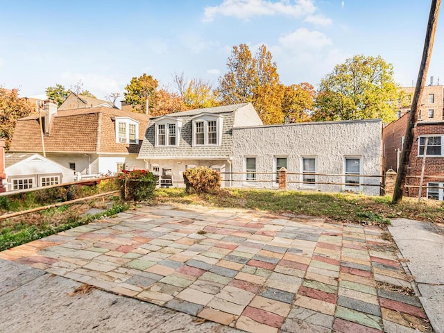 rear view of house featuring a patio