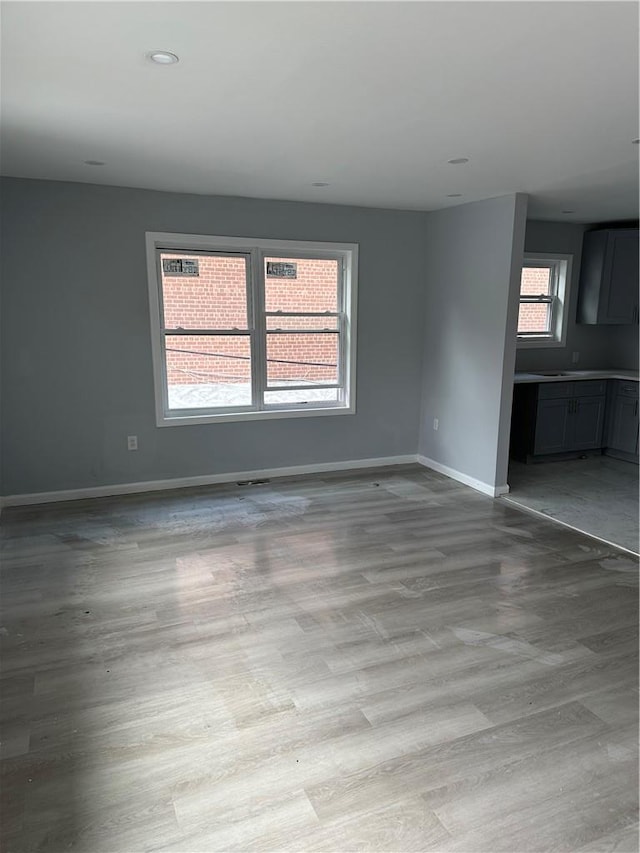 unfurnished room featuring a healthy amount of sunlight