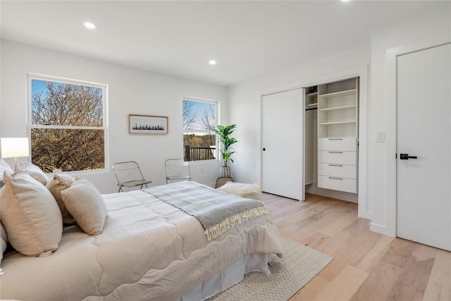 bedroom with a closet and light wood-type flooring