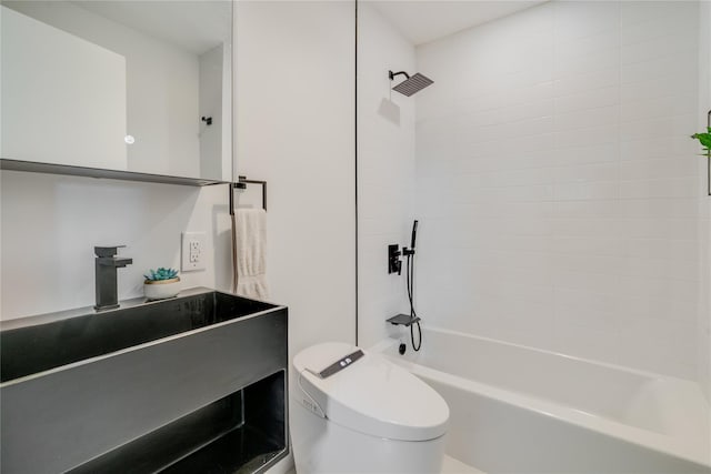 full bathroom featuring toilet, sink, and tiled shower / bath