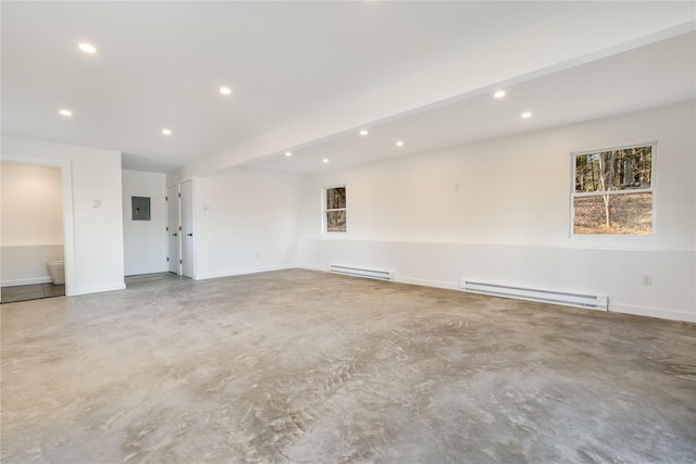 empty room with concrete floors, beam ceiling, and a baseboard radiator