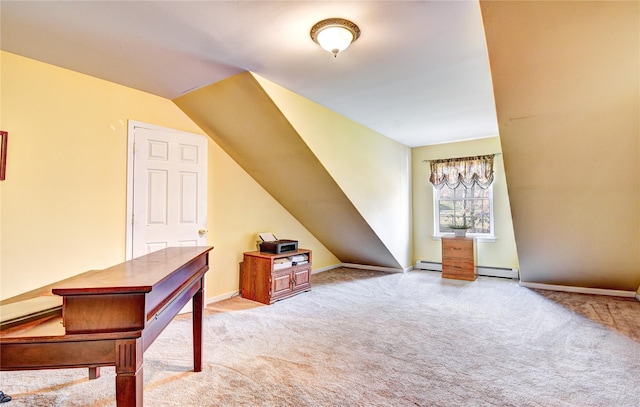 additional living space featuring light carpet and a baseboard heating unit