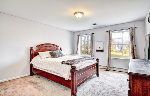 bedroom featuring light colored carpet and a baseboard radiator