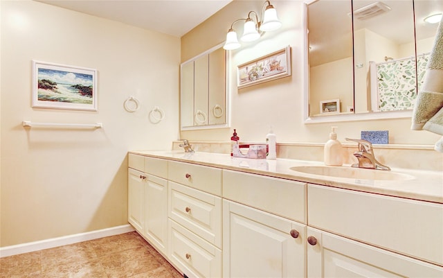 bathroom with tile patterned floors and vanity