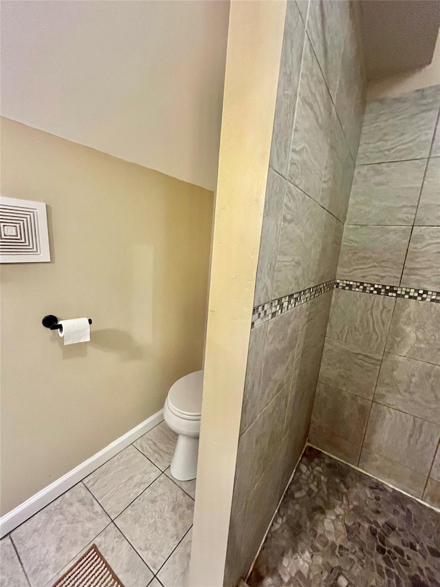 bathroom featuring tile patterned flooring and toilet