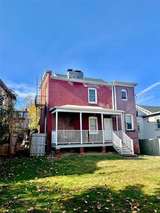 back of house with a yard