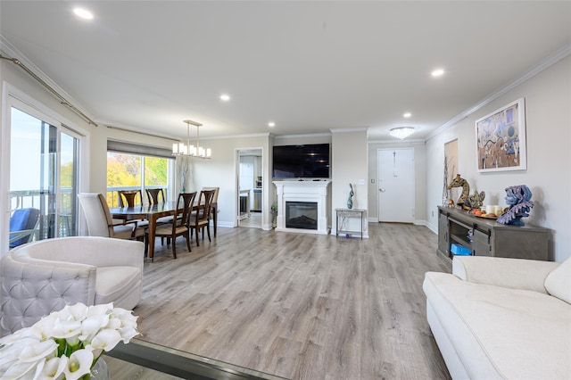 living room featuring light hardwood / wood-style floors and crown molding