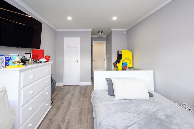 bedroom featuring light hardwood / wood-style floors and ornamental molding