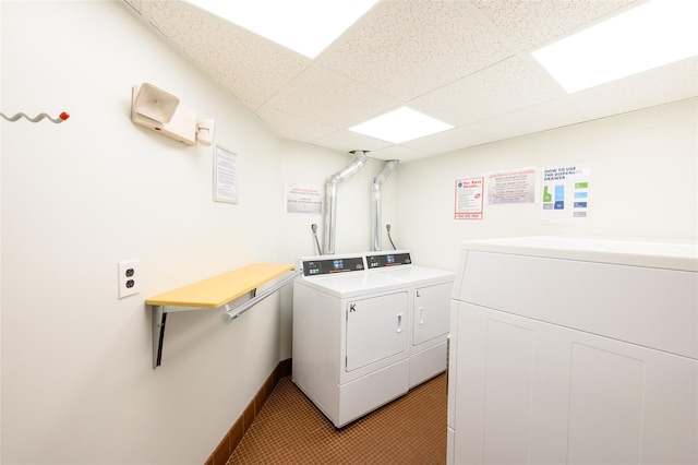 clothes washing area featuring washing machine and clothes dryer