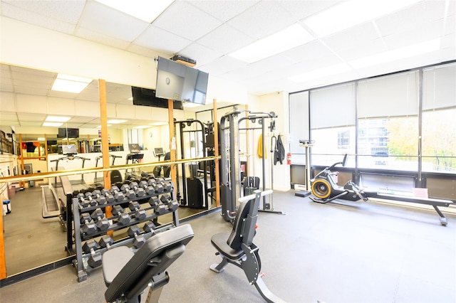 exercise room with a drop ceiling